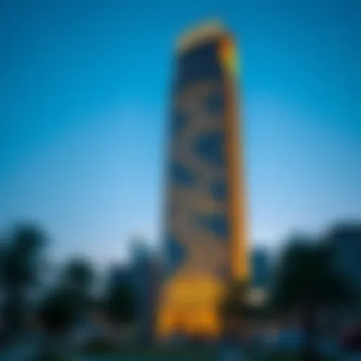 A stunning view of Capricorn Tower at dusk, showcasing its illuminated facade against the evening sky.