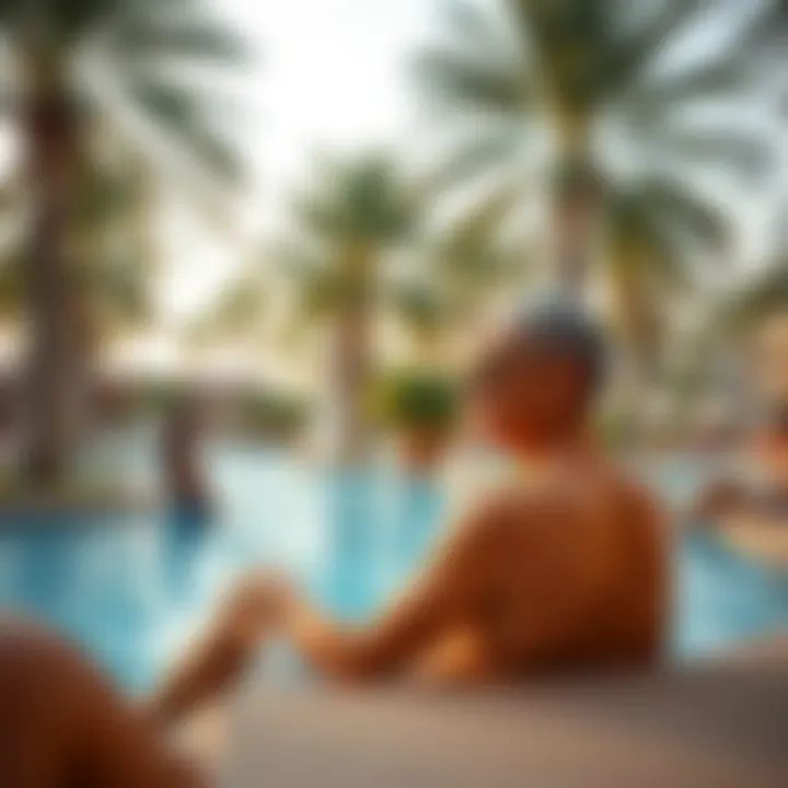 Residents enjoying leisure time by the swimming pool surrounded by palm trees.