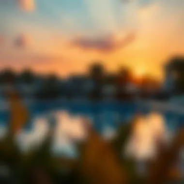 A vibrant sunset casting a warm glow over the communal swimming pool area.
