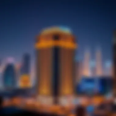 Night view of the Al Kaabi Building illuminated against the Dubai skyline